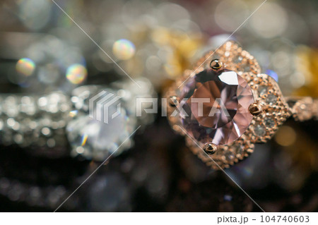 Jewelry wedding diamond rings on black background with reflection 104740603