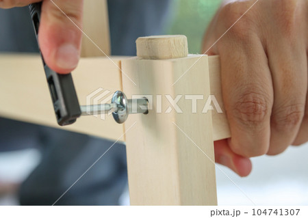 Assembly wooden furniture at home using screw allen 104741307