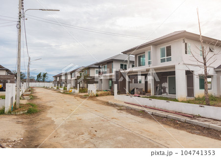construction residential new house in progress at building site construction residential new house in progress at building site 104741353