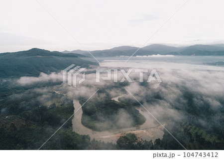 Aerial view canal river in tropical rainforest with morning fog Aerial view canal river in tropical rainforest with morning fog 104743412