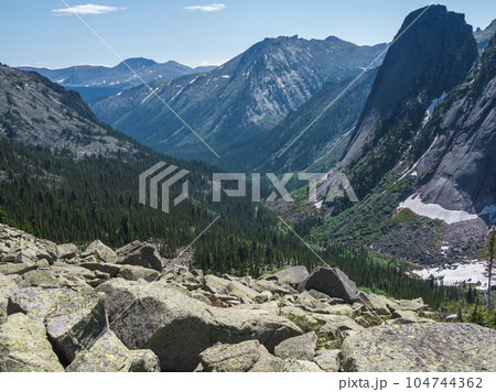 Mountain track through Western Sayans kurumnik, stones, cobblestones, moss with a unique landscape. Landscape photography of stone river (called also stone run, stone stream or stone sea. 104744362