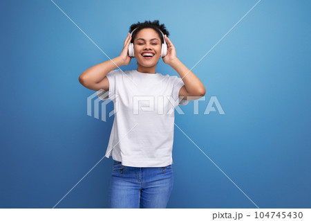 young happy hispanic brunette woman podcast lover with headphones without wire 104745430