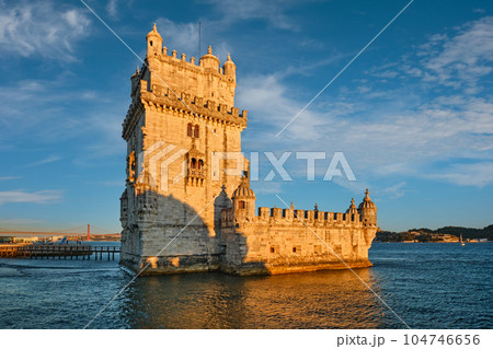 Belem Tower or Tower of St Vincent - famous tourist landmark of Lisboa and tourism attraction - on the bank of the Tagus River Tejo on sunset. Lisbon, Portugal Belem Tower or Tower of St Vincent - famous tourist landmark of Lisboa and tourism attraction - on the bank of the Tagus River Tejo on sunset. Lisbon, Portugal 104746656
