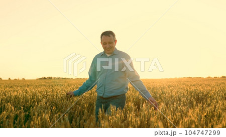 Experience the Golden Harvest with Our Expert Agronomist Our skilled agriculturist walks through the lush green fields, inspecting every ripe ear of wheat with care. As the sun sets, Experience the Golden Harvest with Our Expert Agronomist Our skilled agriculturist walks through the lush green fields, inspecting every ripe ear of wheat with care. As the sun sets, 104747299