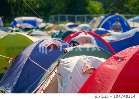 Camping tents on ground in summer park during festival 104748214