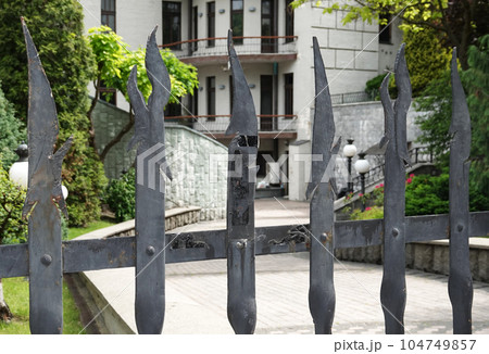 Kiev, Ukraine June 10, 2021: The facade of the building "House with Chimeras" its architectural decoration with sculptures and sculptures of animals and demons Kiev, Ukraine June 10, 2021: The facade of the building "House with Chimeras" its architectural decoration with sculptures and sculptures of animals and demons 104749857