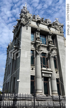 Kiev, Ukraine June 10, 2021: The facade of the building "House with Chimeras" its architectural decoration with sculptures and sculptures of animals and demons 104749860