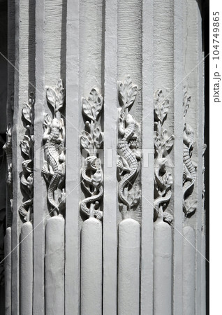 Kiev, Ukraine June 10, 2021: The facade of the building "House with Chimeras" its architectural decoration with sculptures and sculptures of animals and demons 104749865