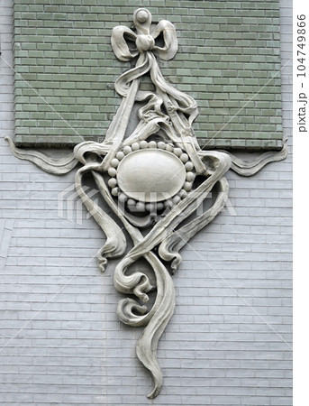 Kiev, Ukraine June 10, 2021: The facade of the building "House with Chimeras" its architectural decoration with sculptures and sculptures of animals and demons Kiev, Ukraine June 10, 2021: The facade of the building "House with Chimeras" its architectural decoration with sculptures and sculptures of animals and demons 104749866