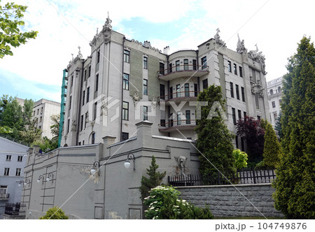 Kiev, Ukraine June 10, 2021: The facade of the building "House with Chimeras" its architectural decoration with sculptures and sculptures of animals and demons 104749876