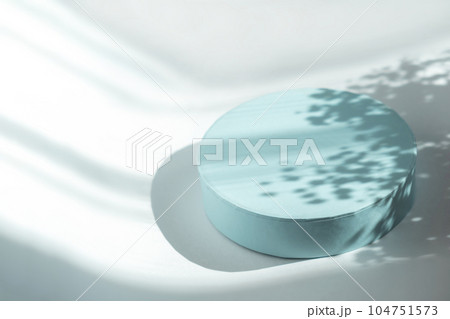 Podium for cosmetic product presentation. Abstract minimal form with geometrical form. Cylinder podium with Floral sunlight shadow. Scene to show products. Showcase, display case. Flat lay, top view Podium for cosmetic product presentation. Abstract minimal form with geometrical form. Cylinder podium with Floral sunlight shadow. Scene to show products. Showcase, display case. Flat lay, top view 104751573