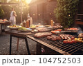A man with a barbecue plate at a party between friends. Food, people and family time concept. 104752503