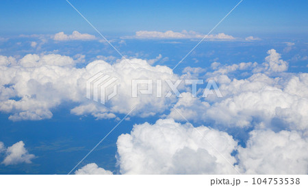 View of the clouds from the airplane window. Flying above the clouds. Traveling by air 104753538