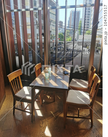 Restaurant table and chairs by window and view of Tokyo street Restaurant table and chairs by window and view of Tokyo street 104755517