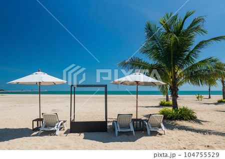 Relax sunbed or deck chairs with parasol on beach, Cha Am 104755529