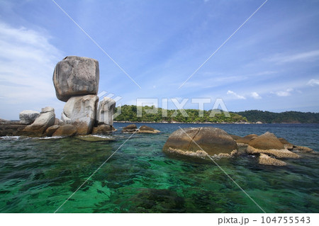 Stack natural stone arch above turquoise sea, Ko Lipe island Stack natural stone arch above turquoise sea, Ko Lipe island 104755543