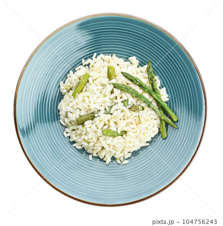Delicious risotto with asparagus isolated on white, top view 104756243