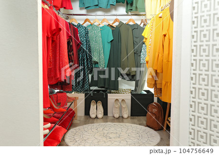 Different stylish clothes and shoes in dressing room. Fashion blogger 104756649