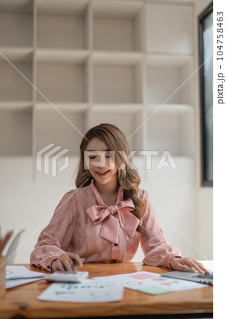 business woman hand press calculator to calculate the company's financial results On the table in the office and business work background, tax, accounting, statistics, and analytical research business woman hand press calculator to calculate the company's financial results On the table in the office and business work background, tax, accounting, statistics, and analytical research 104758463