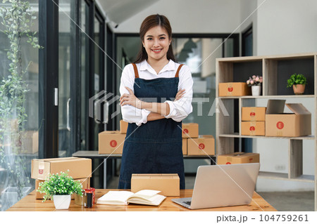 Happy asian woman work from home packaging, on line marketing packaging and delivery, SME concept Happy asian woman work from home packaging, on line marketing packaging and delivery, SME concept 104759261