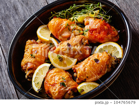 roast chicken thighs with lemon, thyme and spices roast chicken thighs with lemon, thyme and spices 104765679