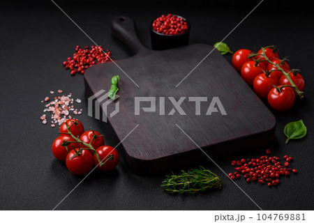 Ingredients for cooking cherry tomatoes, salt, spices and herbs Ingredients for cooking cherry tomatoes, salt, spices and herbs 104769881