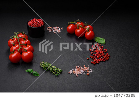 Ingredients for cooking cherry tomatoes, salt, spices and herbs 104770289