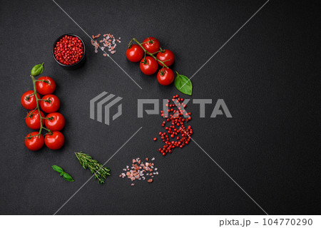Ingredients for cooking cherry tomatoes, salt, spices and herbs 104770290