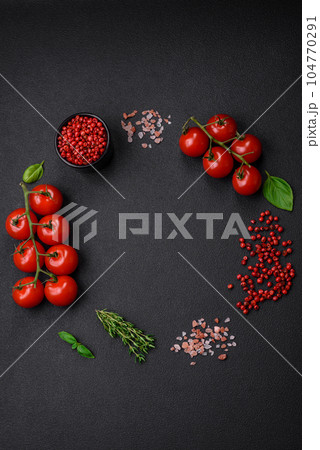Ingredients for cooking cherry tomatoes, salt, spices and herbs 104770291