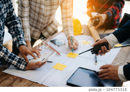 Engineer Teamwork Meeting, Drawing working on blueprint meeting for project working with partner on model building at company office. Asian industry professional team. 104773318