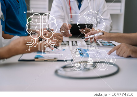 Medical team working on digital tablet healthcare doctor technology tablet using computer analyzed the results of medical reports, an online conference at the hospital. Medical team working on digital tablet healthcare doctor technology tablet using computer analyzed the results of medical reports, an online conference at the hospital. 104774810