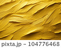 Texture of yellow paint applied to the wall. 104776468