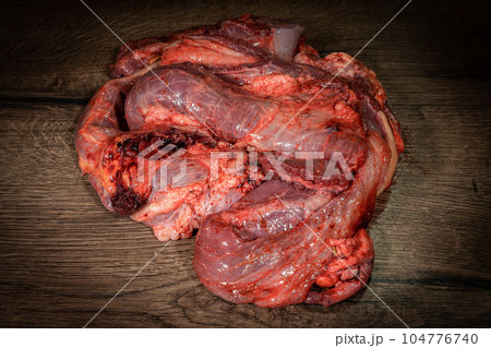 raw cow beef parts on wooden background. Fresh beef parts for sale. Food for dog 104776740