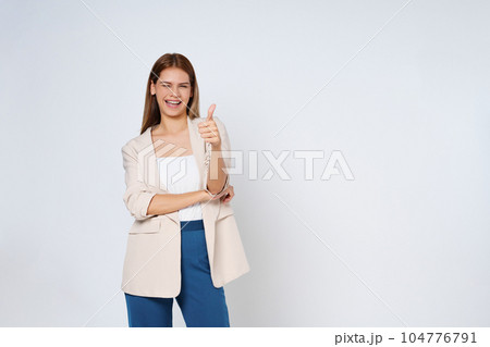 Young woman showing thumbs up isolated on white background. Young woman showing thumbs up isolated on white background. 104776791