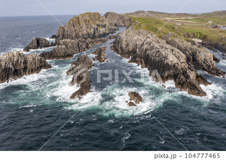 Aerial view of the coastline at Malin Head in Ireland. 104777465