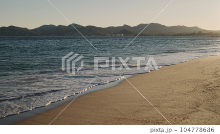 shot of evening waves on Cannes beach before sunset 104778686