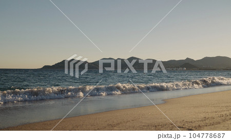 shot of evening waves on Cannes beach before sunset 104778687