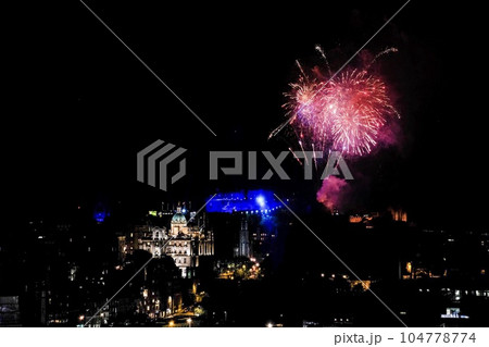 Fireworks over Edinburgh Castle with view of the city. Finale of Edinburgh International Festival in United Kingdom. Fireworks over Edinburgh Castle with view of the city. Finale of Edinburgh International Festival in United Kingdom. 104778774