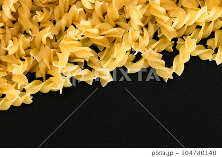 Uncooked Fusilli Pasta with Copy Space Uncooked Fusilli Pasta with Copy Space 104780140