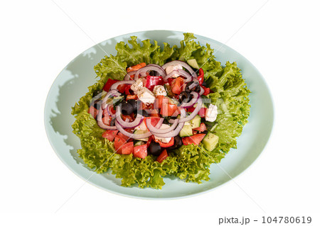 Salad with lettuce, chicken, cherry tomatoes and eggs. Seasoned with sauce. On a colored background. Salad with lettuce, chicken, cherry tomatoes and eggs. Seasoned with sauce. On a colored background. 104780619