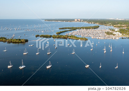 Aerial view of boats moored off Dinner Key Marina in Coconut Grove, Florida. Aerial view of boats moored off Dinner Key Marina in Coconut Grove, Florida. 104782026