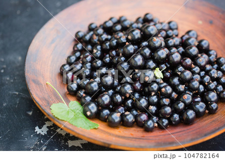 black currants in a large bowl black currants in a large bowl 104782164
