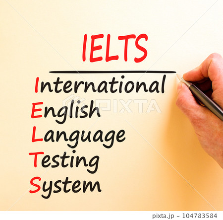 IELTS symbol. Concept words IELTS international english language testing system on white paper. Beautiful brown background. Business IELTS international english language testing system concept. IELTS symbol. Concept words IELTS international english language testing system on white paper. Beautiful brown background. Business IELTS international english language testing system concept. 104783584