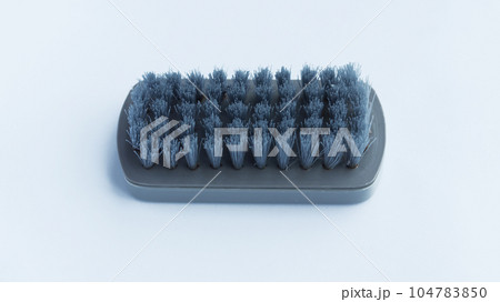 Multifunctional gray scrub plastic brush isolated on white background. Multifunctional gray scrub plastic brush isolated on white background. 104783850