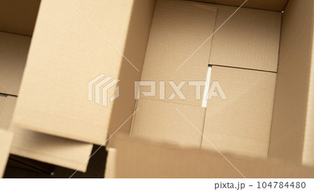 open cardboard boxes close-up, cutout for handle in cardboard box 104784480