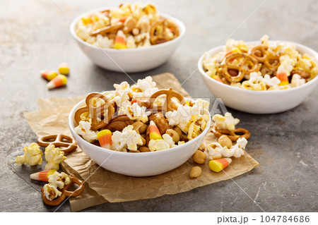 Homemade Halloween trail mix with popcorn, pretzels and nuts 104784686