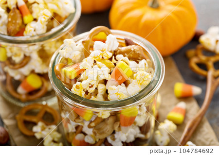 Homemade Halloween trail mix with popcorn, pretzels and nuts Homemade Halloween trail mix with popcorn, pretzels and nuts 104784692