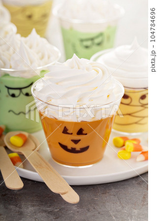 Funny Halloween themed puddings in cups 104784696