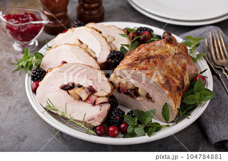 Roasted pork with apple filling 104784881