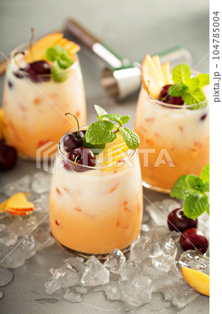 Summer cherry and peach coconut milk cocktail 104785004